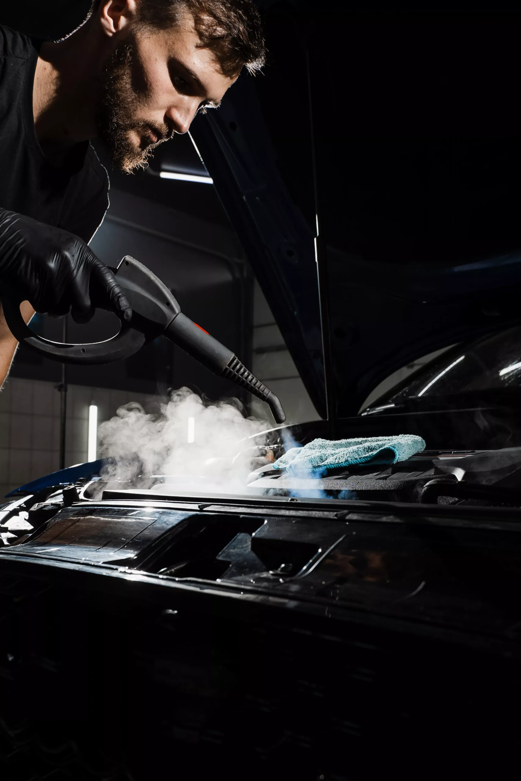 process-steam-cleaning-car-engine-from-dust-dirt-steaming-washing-motor-auto-detailing-auto-service